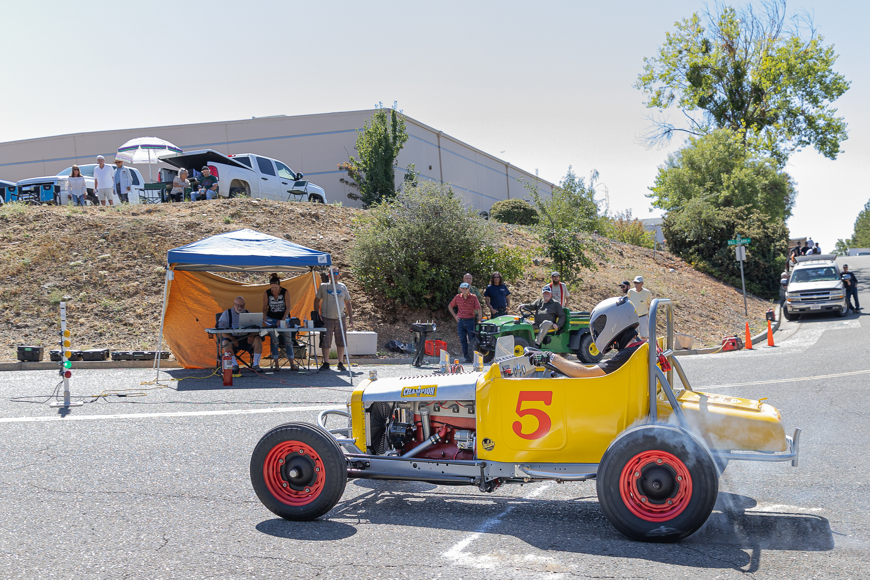Mason Solberg at Auburn Hill Climb start line, with club officials in background